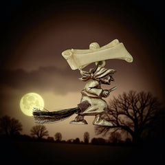 Vintage French brooch depicting a witch flying on a broom, crafted from celluloid with horsehair bristles; she wears a headscarf and holds a wand, mid-century design from the 1950s–60s, approx. 1¾" x 1½", in very good condition with secure pin back and folk-inspired detailing.