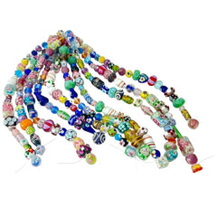 A strand of vintage Chinese lampwork beads from the 1990s, featuring colorful floral and geometric designs in various shapes like oval, cube, and round tube. Each strand includes approximately 20 unique glass beads, new old stock, with a vibrant and playful aesthetic.