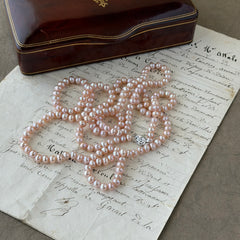 Vintage Chinese light pink freshwater pearl necklace with silver‑tone clasp engraved with Chinese characters.