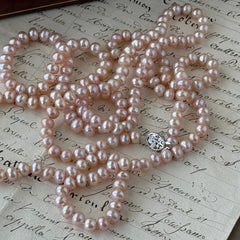 Vintage Chinese light pink freshwater pearl necklace with silver‑tone clasp engraved with Chinese characters.