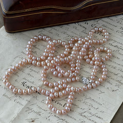 Vintage Chinese light pink freshwater pearl necklace with silver‑tone clasp engraved with Chinese characters.
