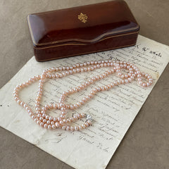 Vintage Chinese light pink freshwater pearl necklace with silver‑tone clasp engraved with Chinese characters.