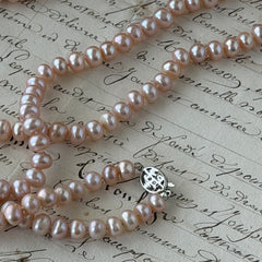 Vintage Chinese light pink freshwater pearl necklace with silver‑tone clasp engraved with Chinese characters.