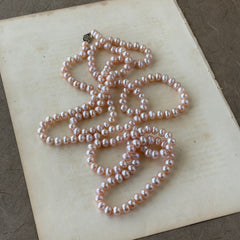 Vintage Chinese light pink freshwater pearl necklace with silver‑tone clasp engraved with Chinese characters.