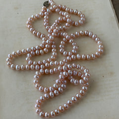 Vintage Chinese light pink freshwater pearl necklace with silver‑tone clasp engraved with Chinese characters.