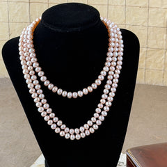 Vintage Chinese light pink freshwater pearl necklace with silver‑tone clasp engraved with Chinese characters.