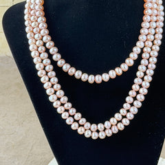 Vintage Chinese light pink freshwater pearl necklace with silver‑tone clasp engraved with Chinese characters.