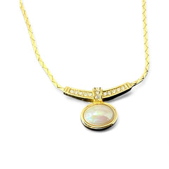 Vintage 1970s Christian Dior necklace featuring a luminous faux pearl pendant accented with pave rhinestones, suspended from a gold plated cobra chain with adjustable spring ring clasp and signed ChrDior © hang tag.