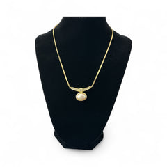 Vintage 1970s Christian Dior necklace featuring a luminous faux pearl pendant accented with pave rhinestones, suspended from a gold plated cobra chain with adjustable spring ring clasp and signed ChrDior © hang tag.