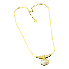 Vintage 1970s Christian Dior necklace featuring a luminous faux pearl pendant accented with pave rhinestones, suspended from a gold plated cobra chain with adjustable spring ring clasp and signed ChrDior © hang tag.