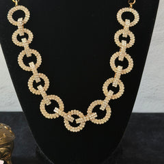 Vintage gold tone necklace with interlocking clear rhinestone circle links and lobster clasp.