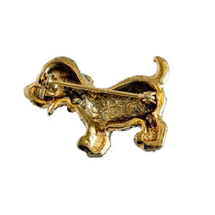 Vintage gold‑tone dog brooch with clear and black pavé rhinestones and a red enamel collar.