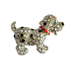 Vintage gold‑tone dog brooch with clear and black pavé rhinestones and a red enamel collar.