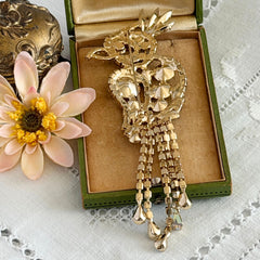 Vintage gold‑tone cockatoo brooch with AB rhinestones and tassel tail, oversized statement bird pin.