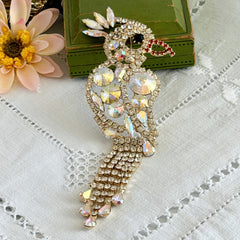 Vintage gold‑tone cockatoo brooch with AB rhinestones and tassel tail, oversized statement bird pin.