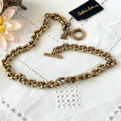 Vintage Cookie Lee gold‑tone cable chain necklace with textured links and toggle clasp, shown in close‑up to display design and condition.