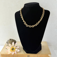 Vintage Cookie Lee gold‑tone cable chain necklace with textured links and toggle clasp, shown in close‑up to display design and condition.