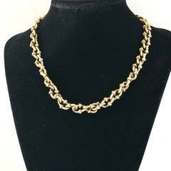 Vintage Cookie Lee gold‑tone cable chain necklace with textured links and toggle clasp, shown in close‑up to display design and condition.