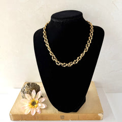 Vintage Cookie Lee gold‑tone cable chain necklace with textured links and toggle clasp, shown in close‑up to display design and condition.