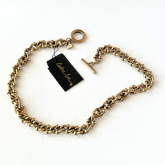 Vintage Cookie Lee gold‑tone cable chain necklace with textured links and toggle clasp, shown in close‑up to display design and condition.