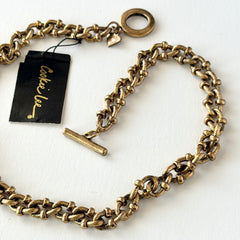Vintage Cookie Lee gold‑tone cable chain necklace with textured links and toggle clasp, shown in close‑up to display design and condition.