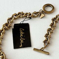 Vintage Cookie Lee gold‑tone cable chain necklace with textured links and toggle clasp, shown in close‑up to display design and condition.