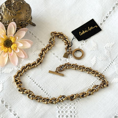 Vintage Cookie Lee gold‑tone cable chain necklace with textured links and toggle clasp, shown in close‑up to display design and condition.