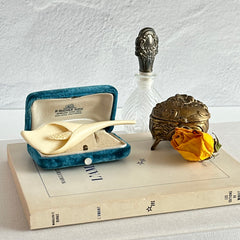 Cream molded celluloid calla lily statement brooch with textured spadix.