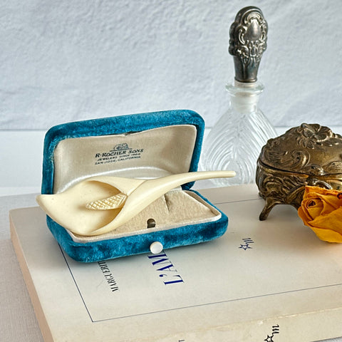 Cream molded celluloid calla lily statement brooch with textured spadix.