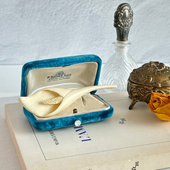 Cream molded celluloid calla lily statement brooch with textured spadix.