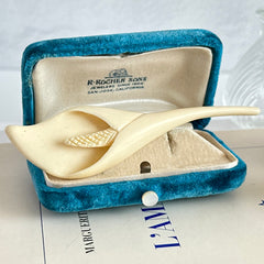 Cream molded celluloid calla lily statement brooch with textured spadix.