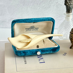 Cream molded celluloid calla lily statement brooch with textured spadix.