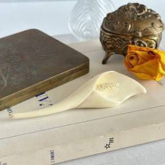 Cream molded celluloid calla lily statement brooch with textured spadix.