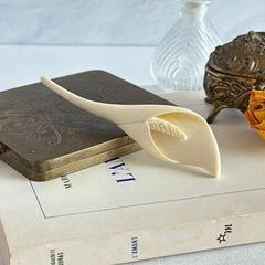 Cream molded celluloid calla lily statement brooch with textured spadix.