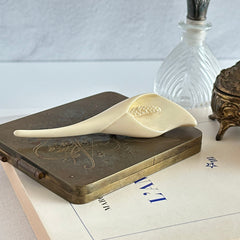 Cream molded celluloid calla lily statement brooch with textured spadix.