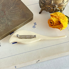 Cream molded celluloid calla lily statement brooch with textured spadix.