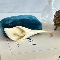 Cream molded celluloid calla lily statement brooch with textured spadix.