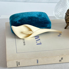Cream molded celluloid calla lily statement brooch with textured spadix.