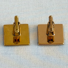 Vintage Amita Japan damascene square cufflinks with gold and silver bamboo motif on black enamel, signed on the back, displayed on a neutral surface.