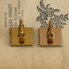 Vintage Amita Japan damascene square cufflinks with gold and silver bamboo motif on black enamel, signed on the back, displayed on a neutral surface.