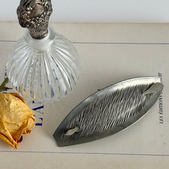 Vintage Danish S.I.D. pewter hair barrette with textured diagonal surface and signed back, elongated oval shape, 1970s–80s Scandinavian design.