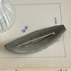 Vintage Danish S.I.D. pewter hair barrette with textured diagonal surface and signed back, elongated oval shape, 1970s–80s Scandinavian design.