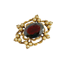 Vintage gold‑tone Victorian Revival brooch with red faceted glass cabochon and faux pearls.