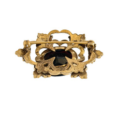 Vintage gold‑tone Victorian Revival brooch with red faceted glass cabochon and faux pearls.