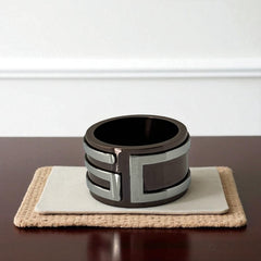 Dolce & Gabbana men's stainless steel ring with brown finish and raised silver-tone logo; bold designer accessory in size 8.5 with wide band styling.