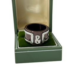 Dolce & Gabbana men's stainless steel ring with brown finish and raised silver-tone logo; bold designer accessory in size 8.5 with wide band styling.