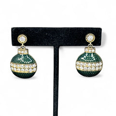 Vintage Eisenberg Ice Christmas ornament earrings with green enamel, clear rhinestone band, and gold-tone stud; signed and festive dangle design.
