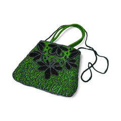 Vintage 1990s emerald green satin evening bag with handsewn black and hematite glass bead floral motifs, dual green handles, and optional crossbody cord, photographed to show craftsmanship, texture, and convertible styling.