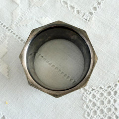 Antique silver‑plated napkin ring with beaded borders and engraved E.L.A. No. 3.