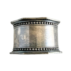 Antique silver‑plated napkin ring with beaded borders and engraved E.L.A. No. 3.